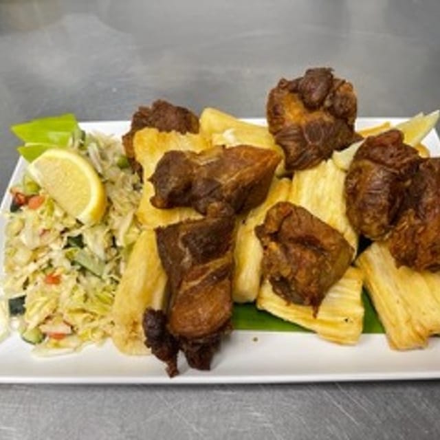 Yuca Frita Con Chicharon (Fried Yucca with Pork Rinds).